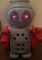 Robô Andador Vermelho Luzes e Sons Magic Toys 48 Cm Fala Olhos Acende